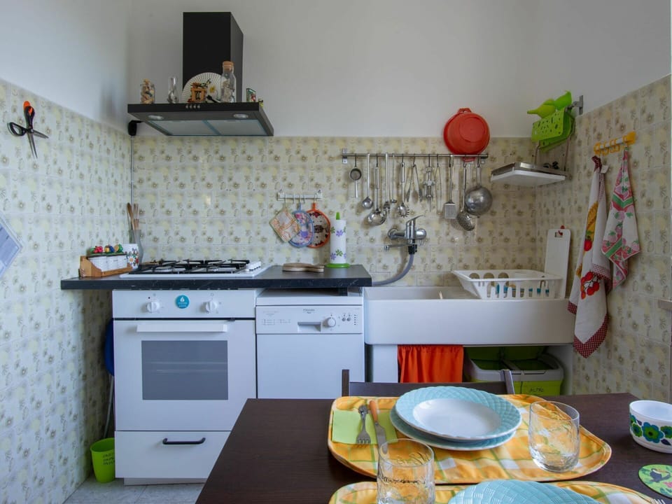 Room, Property, Kitchen, Furniture, Interior Design, Orange, House, Yellow, Shelf, Table