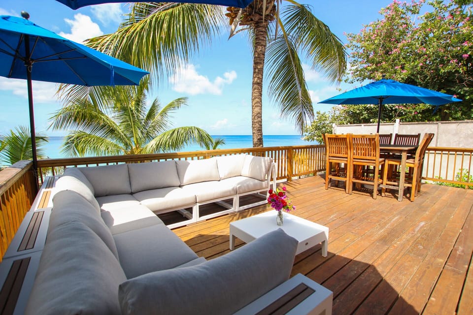 The spacious deck  - both covered by umbrellas