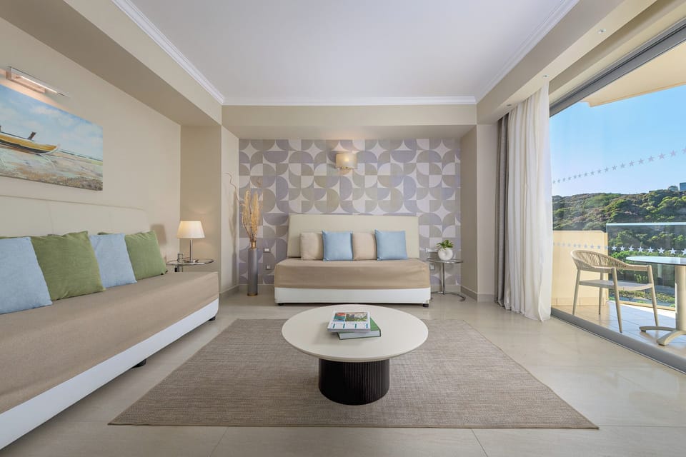 Superior Suite, Partial Sea View | Minibar, in-room safe, free cribs/infant beds, free WiFi