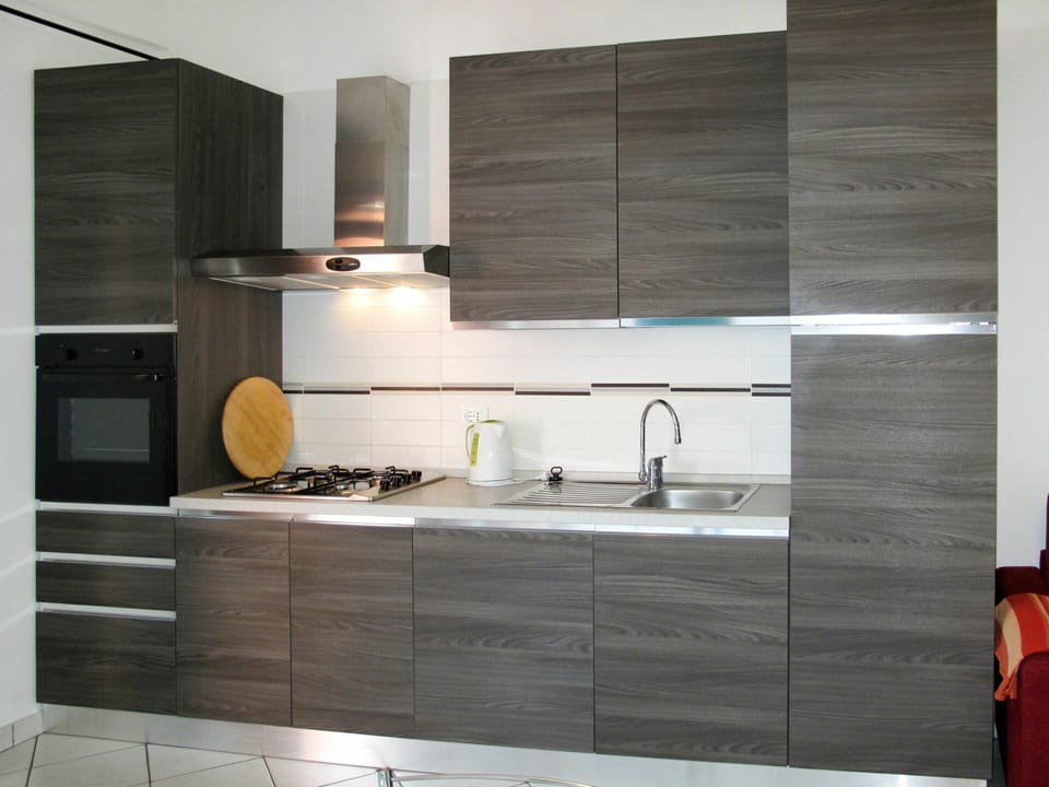 Countertop, Room, Tile, Furniture, Property, Cabinetry, Kitchen, Interior Design, Floor, Lighting