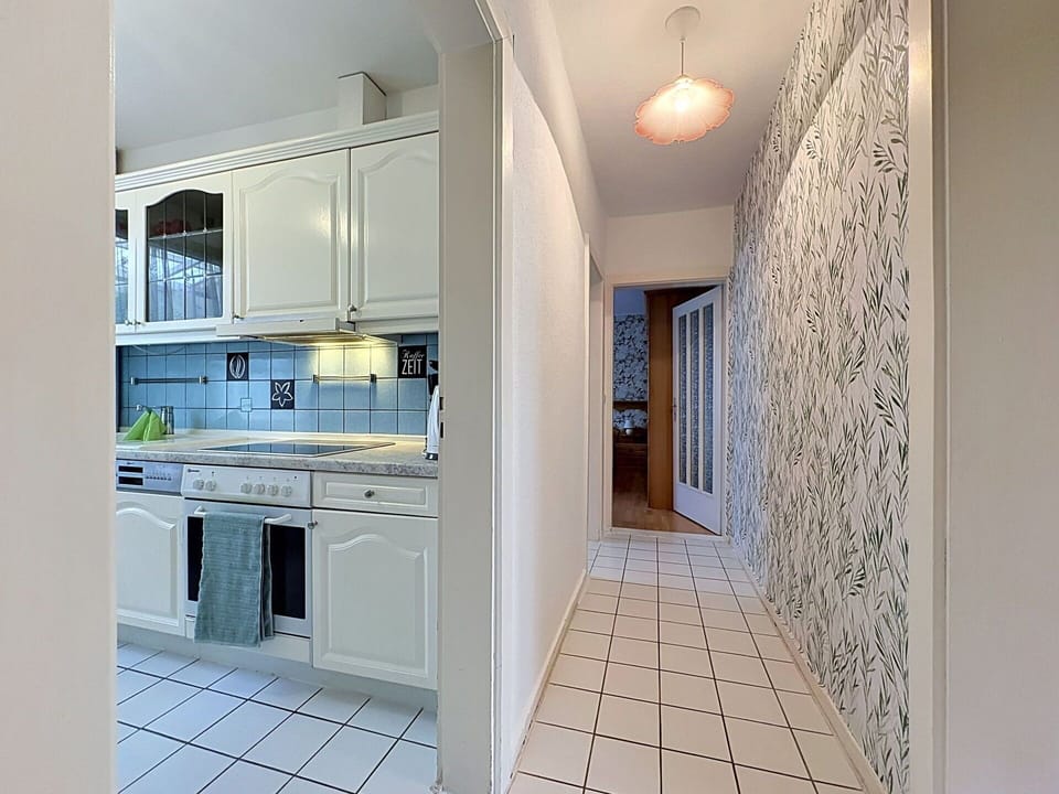 Flooring, Interior Design, Floor, Countertop, Ceiling, Kitchen, Room, Lighting, Apartment, Cabinetry