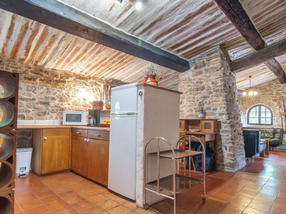 Building, Cabinetry, Wood, Lighting, Kitchen Appliance, Refrigerator, Kitchen, Countertop, Beam, Floor