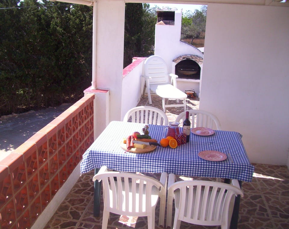 Across the outside dining area towards the barbecue
