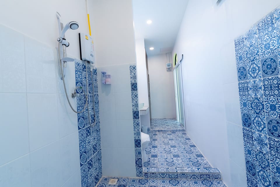 Premium House | Bathroom | Shower, free toiletries, slippers, towels