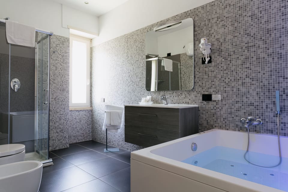 Junior Double Room | Bathroom | Shower, rainfall showerhead, hair dryer, slippers