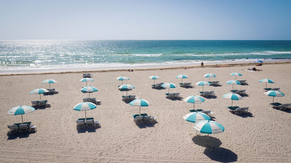 Beach nearby, white sand, sun loungers, beach towels