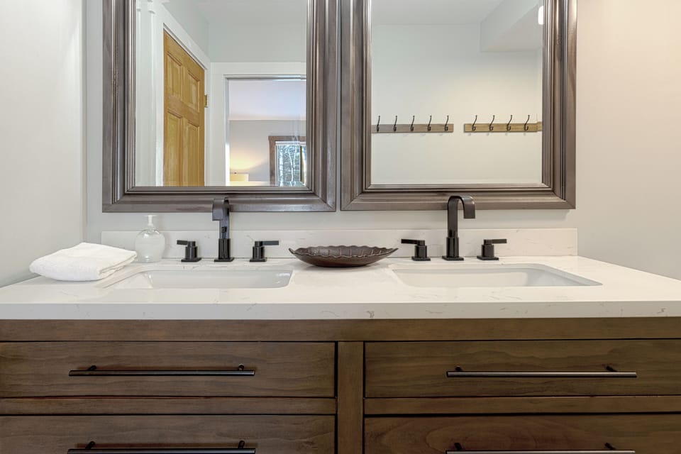 This modern bathroom has double sinks.