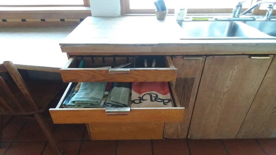 Sharp knives, dish clothes & towels, and the lower drawer is an iron.
