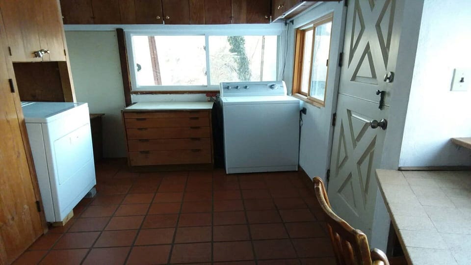 Laundry area at the end of the kitchen.