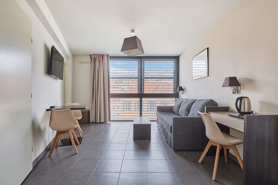This warm and stylish apartment features a well-appointed dining area and a relaxing lounge space, perfect for enjoying quality time with loved ones.