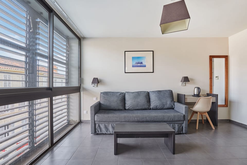 Enjoy abundant natural light streaming through the large windows in this airy, open space, creating the perfect atmosphere for relaxation or work during your stay.