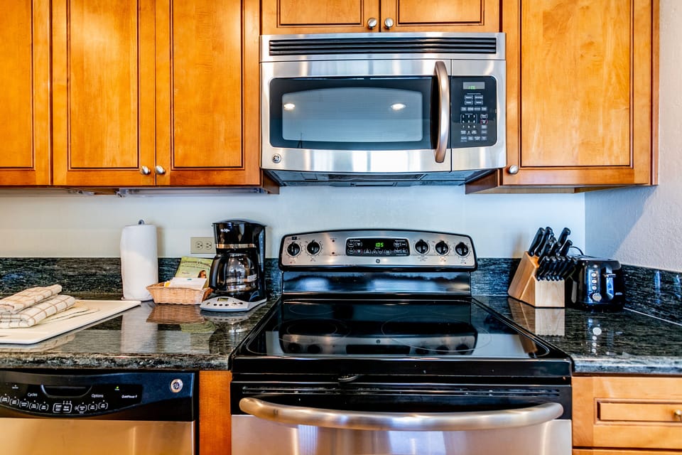 Cook your favorite meals in this fully-equipped kitchen, complete with stainless steel appliances, granite counters, and everything you need for a home-away-from-home experience.