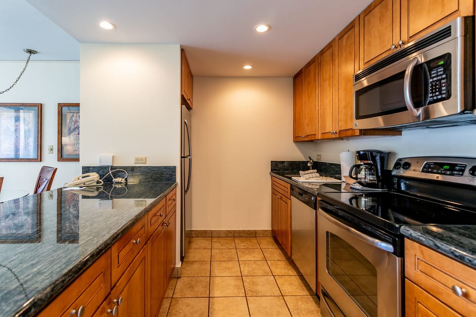 Your fully equipped kitchen with granite countertops, stainless appliances, and everything you need to prepare delicious meals during your stay.