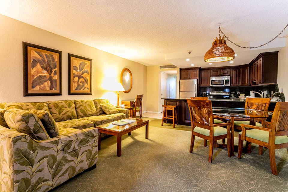 Settle into your spacious retreat with tropical-inspired comfort, where a fully-equipped kitchen, elegant dining space, and plush living area create the perfect home base for your island escape.