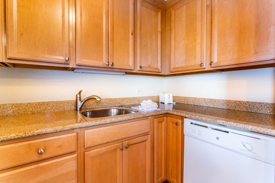 Your fully equipped kitchen features ample storage, granite countertops, and everything you need to prepare meals at your leisure.