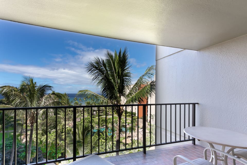 Wake up to your private balcony framing tropical palms and endless ocean views. Start each morning with coffee as gentle breezes and island sounds surround you.