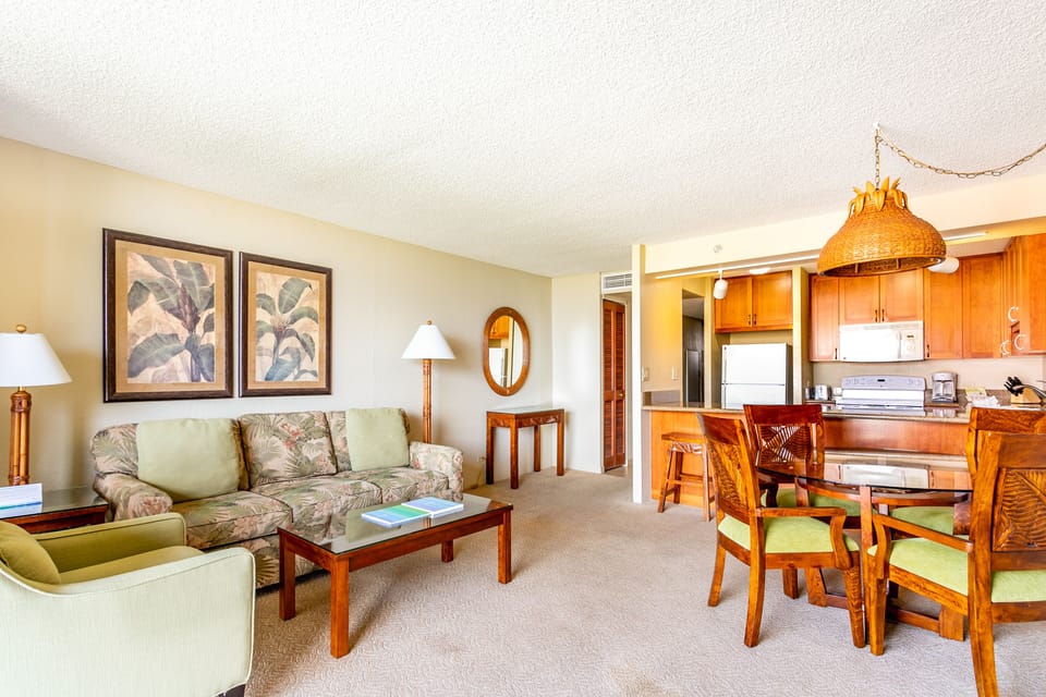 Step into your welcoming open-concept retreat with tropical-inspired décor, complete with a fully-equipped kitchen, cozy dining area, and relaxing living space—perfectly designed for your island getaway.