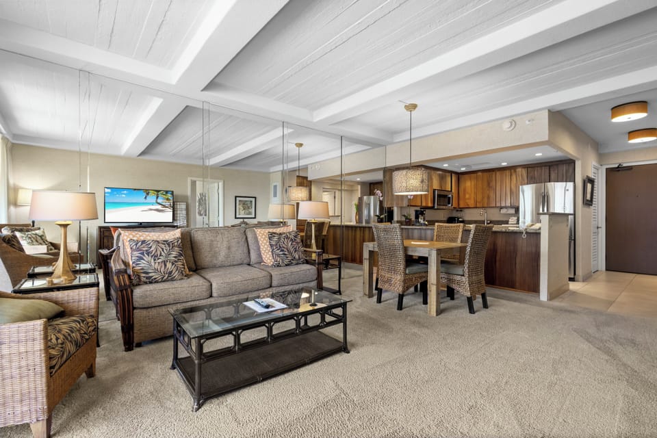 Step into your spacious open-plan retreat where vaulted ceilings and island-inspired décor create an airy, welcoming ambiance for relaxing or entertaining.