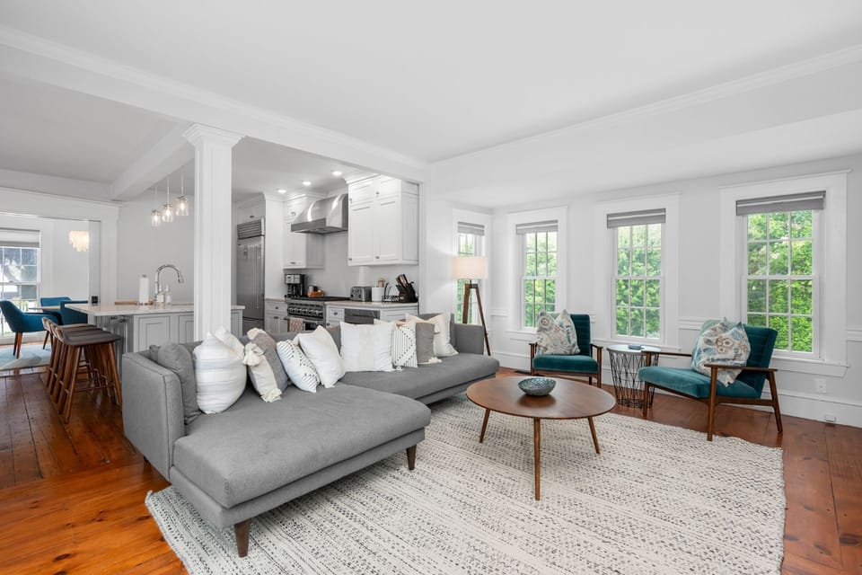 Living room with ample seating opens into the chefs kitchen with island with seating for 4.