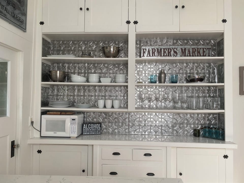Plenty of dishes and wine glasses within close reach!