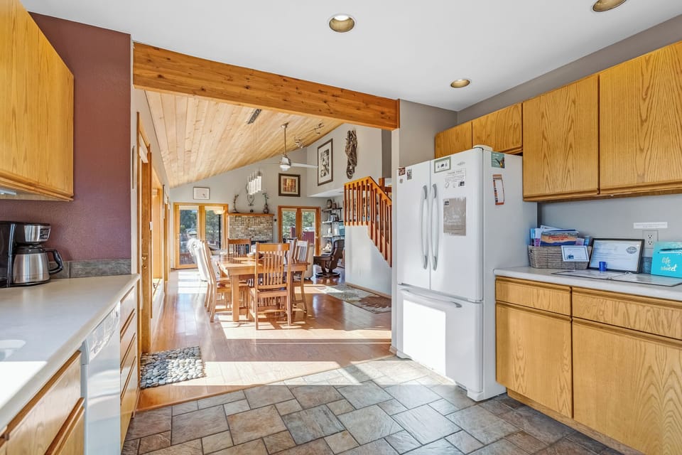 The kitchen is located directly off the dining area.  Large double door refrigerator and bottom drawer freezer.