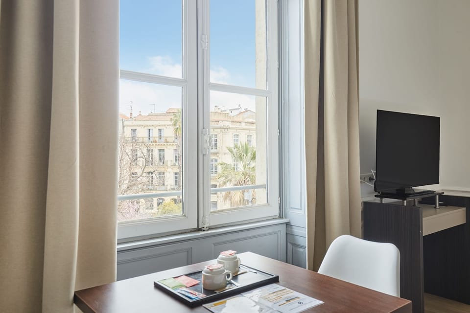 Enjoy natural light and lovely city views from your personal workspace or breakfast table.