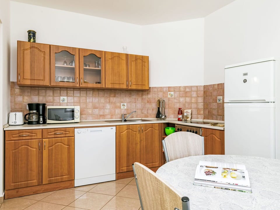 Flooring, Kitchen, Major Appliance, Interior Design, Floor, Cabinetry, Furniture, Kitchen Appliance, Countertop, Room
