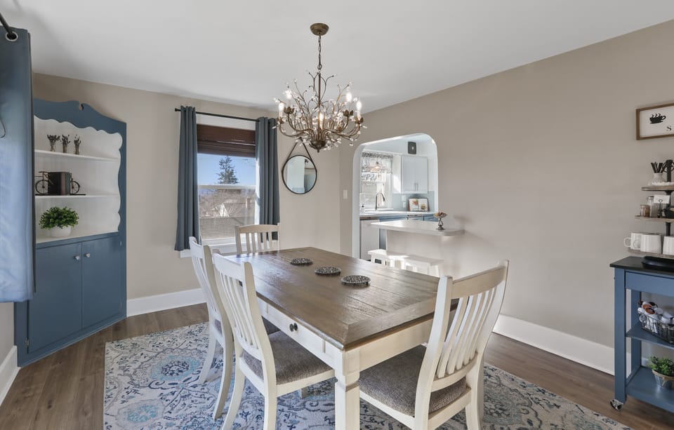The dining room is adjacent to the living room and kitchen.