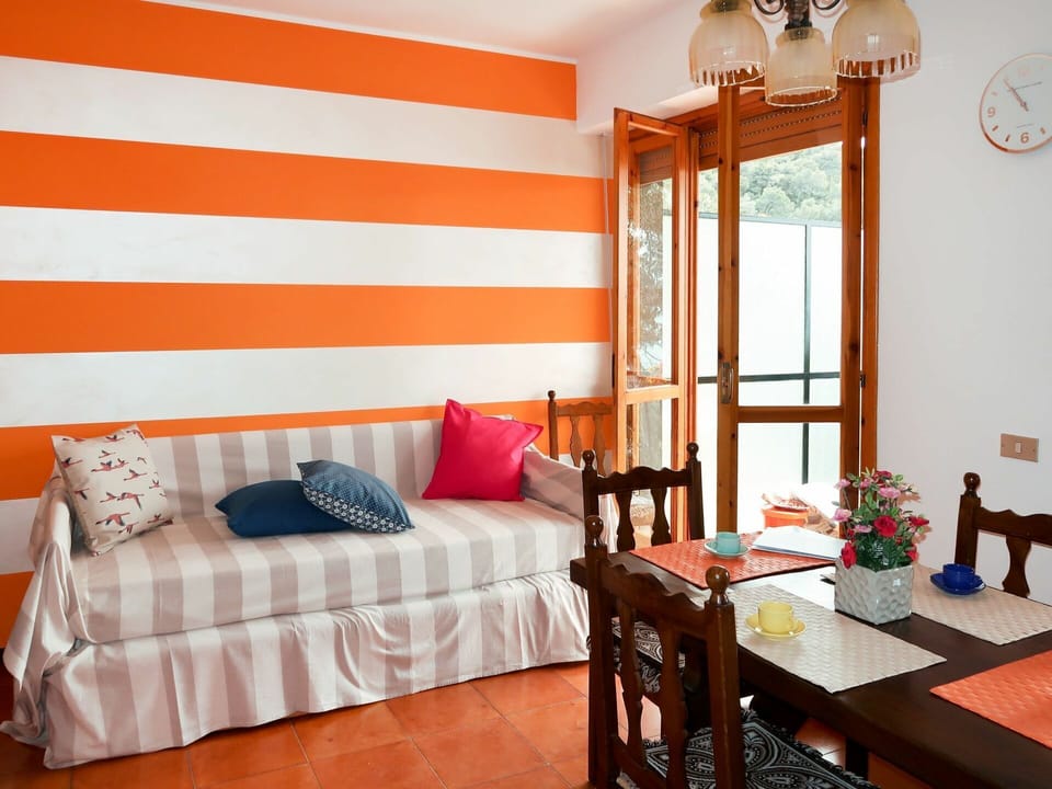 Room, Furniture, Orange, Interior Design, Property, Wall, Red, Curtain, Ceiling, Living Room