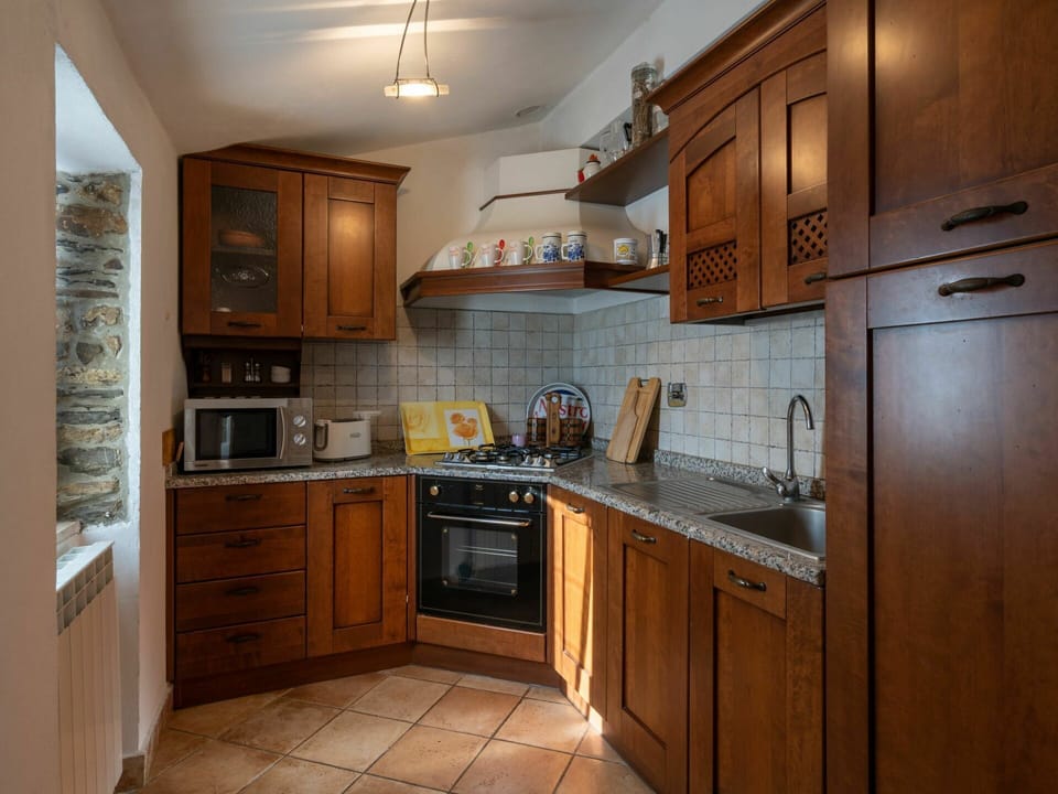 Countertop, Cabinetry, Kitchen, Furniture, Room, Property, Building, Interior Design, Refrigerator, Floor