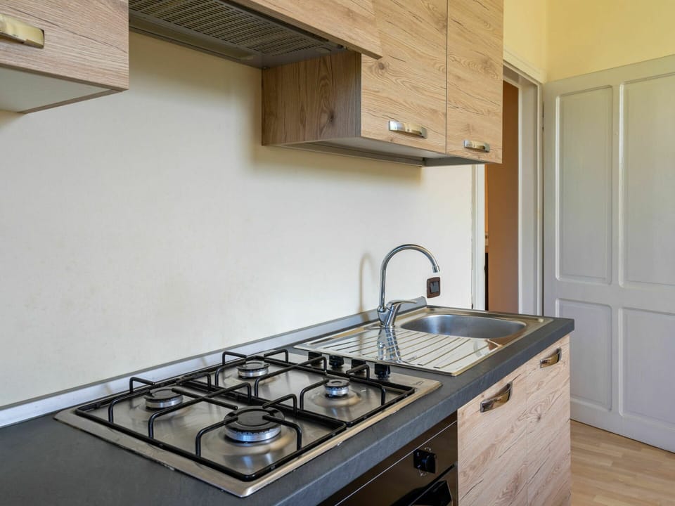 Property, Sink, Kitchen Sink, Room, Countertop, Kitchen, Gas Stove, Cooktop, Kitchen Stove, Cabinetry