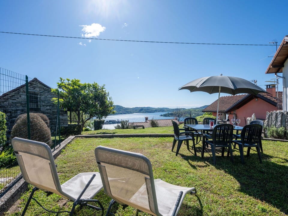 Sky, Plant, Table, Nature, Shade, Chair, Outdoor Furniture, Umbrella, Outdoor Table, Leisure