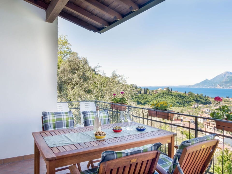Sky, Table, Plant, Furniture, Building, Flowerpot, Chair, Azure, Seaside Resort, Porch
