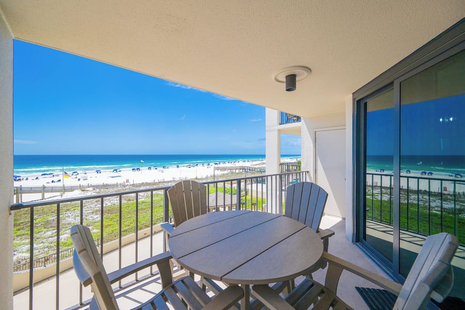 Gentle gulf breezes surround you as you relax around the table on your balcony overlooking the shore