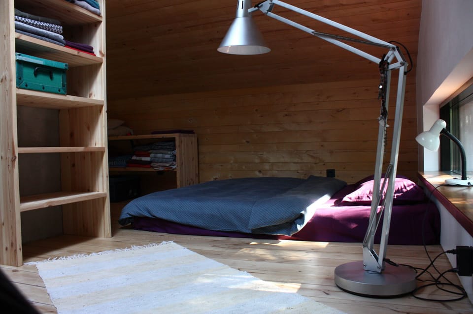 Bed behind chimeny