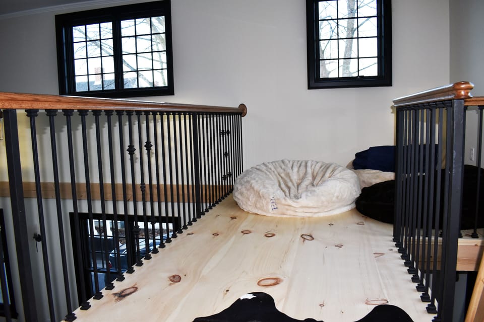 Loft is a fun area to relax.  Flooring is local 70 yr old 18" pine boards.