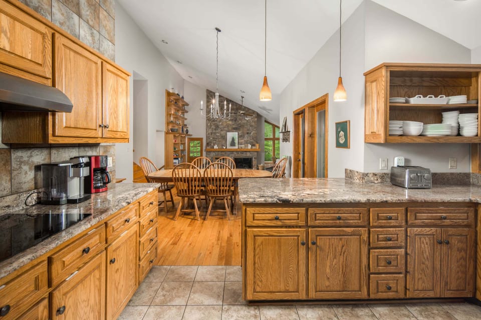 Fully equipped kitchen with granite countertops and plenty of workspace