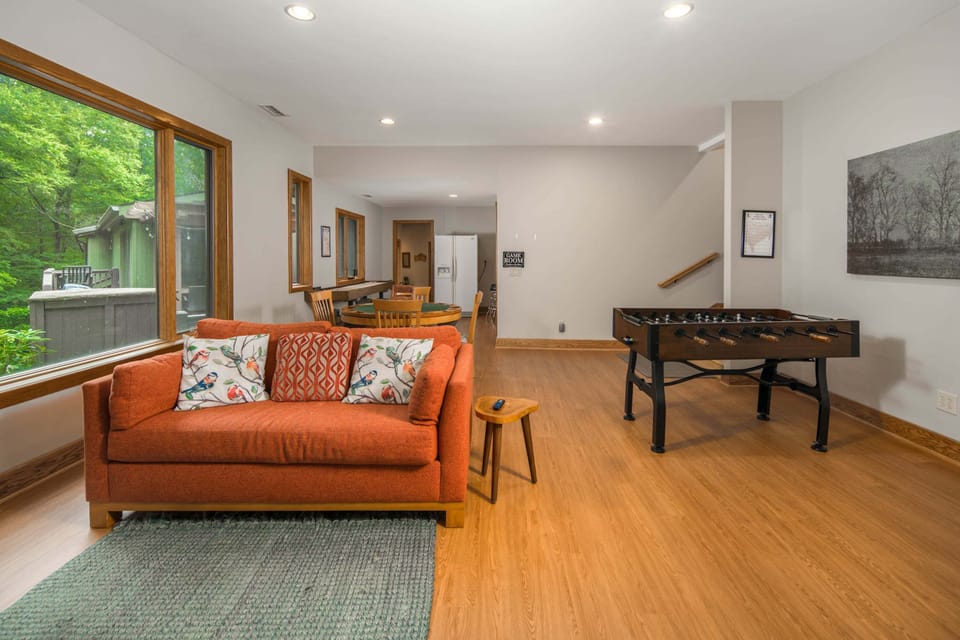 Spacious game room with foosball table and comfortable seating