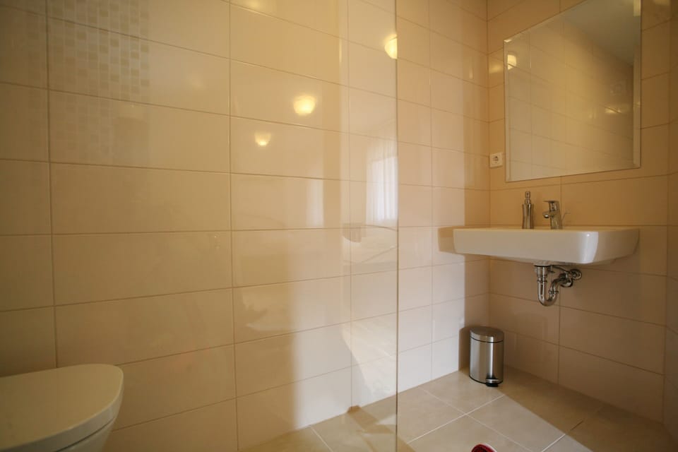 Shower, rainfall showerhead, hair dryer, towels