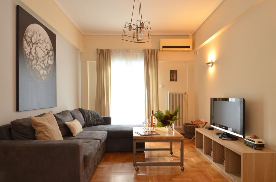 Apartment, 1 Bedroom | Living room | Flat-screen TV