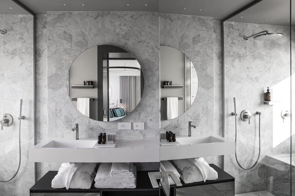 Grand Suite | Bathroom | Rainfall showerhead, eco-friendly toiletries, hair dryer, bathrobes