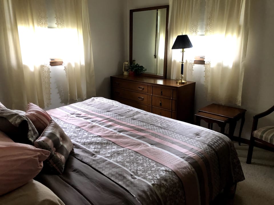 Master bedroom invites peaceful rest and provides spacious personal item storage