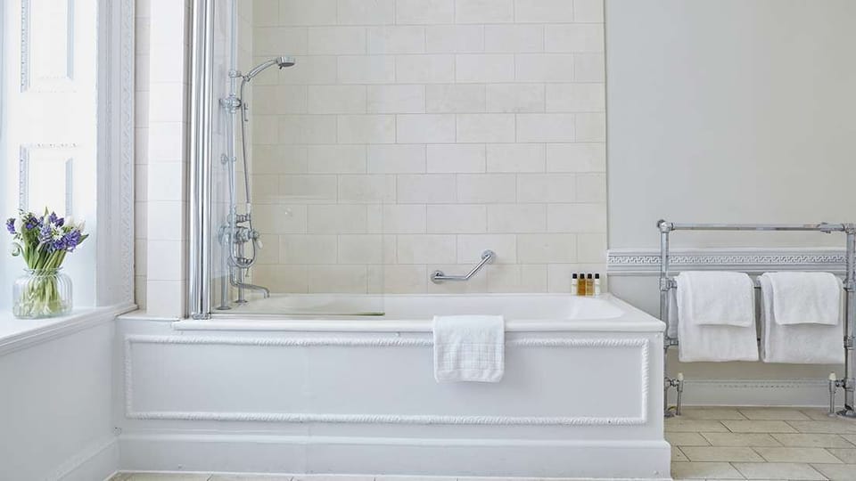 Combined shower/tub, designer toiletries, hair dryer, bathrobes