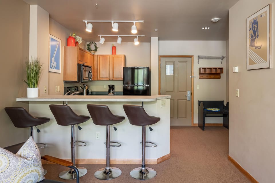 Saddle up to the breakfast bar and enjoy the full size kitchen