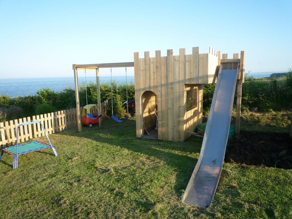 Large garden overlooking sea.