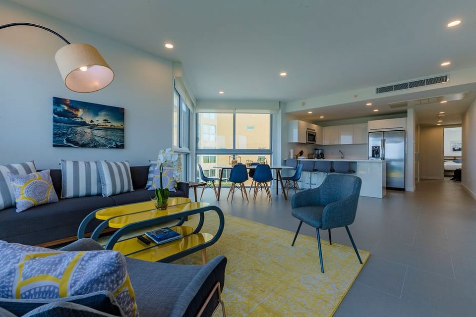 Step into your bright, open living space where modern coastal style meets everyday comfort. Sink into the plush seating, gather around the dining table, and whip up meals in the sleek kitchen—all bathed in natural light and cool sea breezes.
