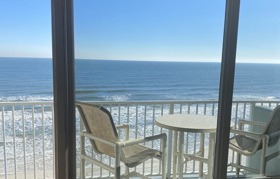 Our balcony over looking pool and beachfront view. Simply amazing view.