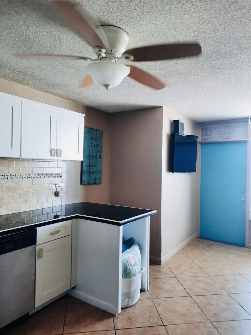 Two person "breakfast bar" flat screen TV, door to ocean front balcony.