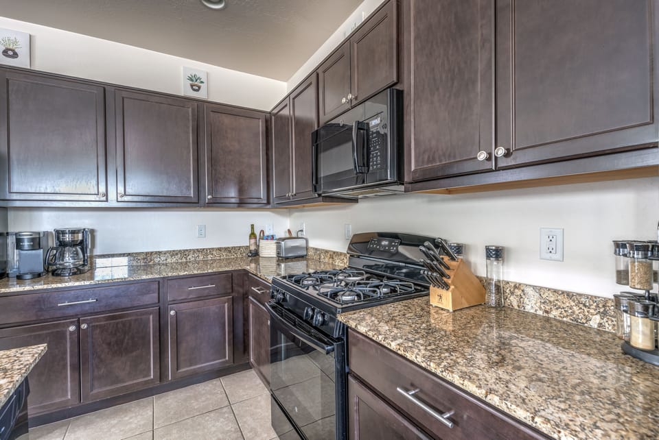 Kitchen features gas stove, microwave and all the essentials.