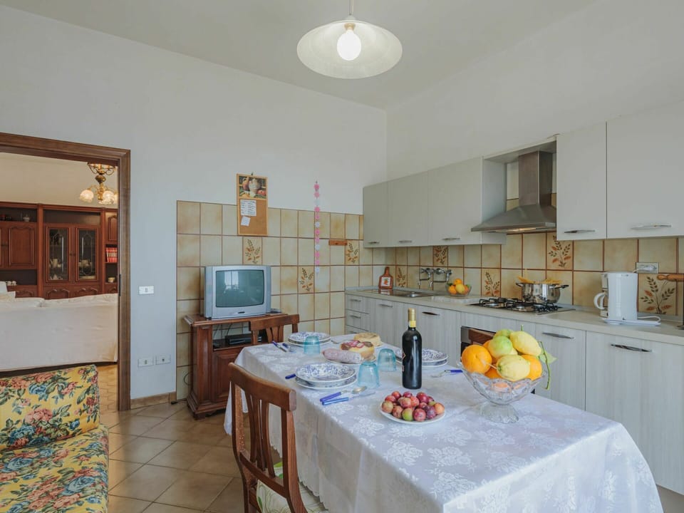 Table, Cabinetry, Property, Tableware, Chair, Lighting, Kitchen, Interior Design, Picture Frame, Countertop